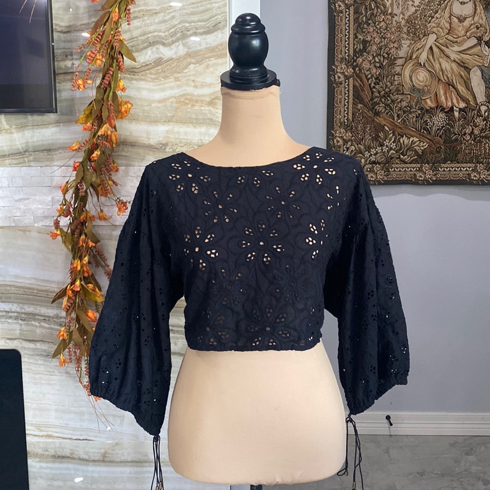 Black eyelet floral tie-back blouse.